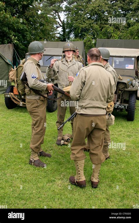 Actors chat whilst dressed in WW2 period US Army GI uniforms at a ...