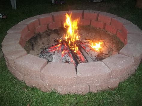 DIY easy fire pit that cost around $50.00. 34 12" retaining wall bricks ...