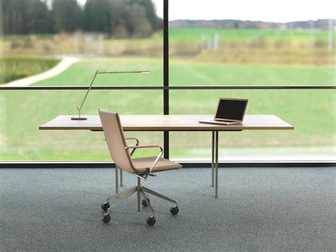 Download Adjustable Office Desk Set Against a Transparent Glass Wall ...