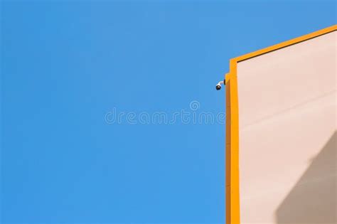 Surveillance Monitoring Security Camera on a House Corner with Blue Sky Stock Image - Image of ...