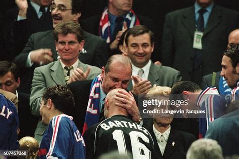 French president Jacques Chirac kissing Fabien Barthez after France's... News Photo - Getty Images