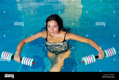 Aquaaerobic girl in fitness center pool Stock Photo - Alamy