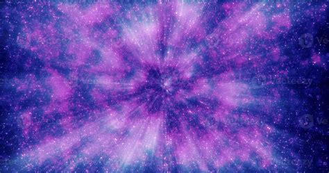 Purple and blue beautiful bright glowing shiny star particles flying in the galaxy in space ...