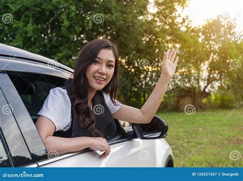 Happy Woman Open Window of Car and Raising Her Hand Stock Image - Image ...