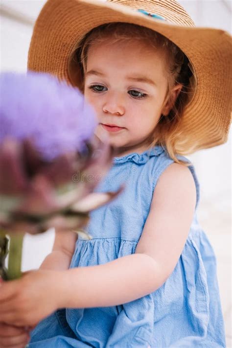 Cute Little Girl Holding Big Artichoke Flower in Hands Stock Image ...