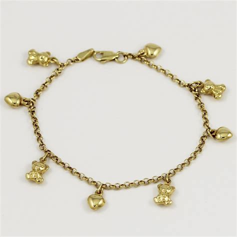 One charming 14k yellow gold charm bracelet. | Gold charm bracelet ...