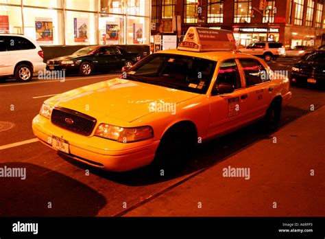 Yellow taxi cab at night New York City, United states of America Stock Photo - Alamy