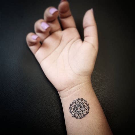 Mini mandala tattoo on the wrist - Tattoogrid.net