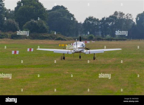 a landing plane on a small airfield Stock Photo - Alamy