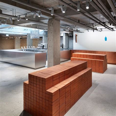 Schemata Architects stacks up red bricks inside South Korea's first Blue Bottle Coffee cafe Bar ...