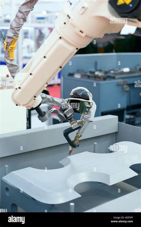 Industrial welding robotic arm Stock Photo - Alamy