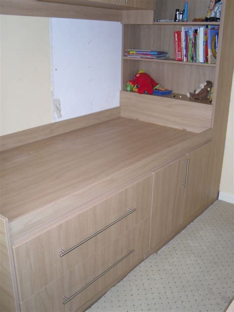 Bed built over stair box | Bedroom storage, Bulkhead bedroom, Small bedroom storage