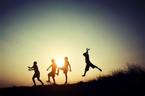 Free Photo | Children's silhouettes playing at sunset