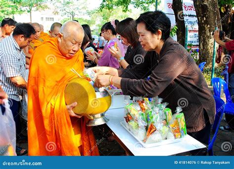 Gives food to a monk editorial photo. Image of godfather - 41814076