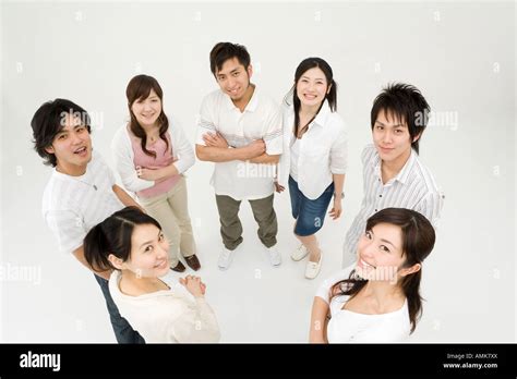 Young people standing in circle Stock Photo - Alamy