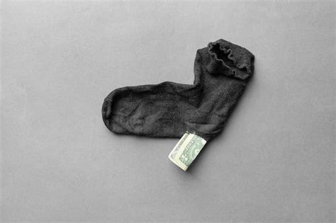 Premium Photo | Money in a old sock