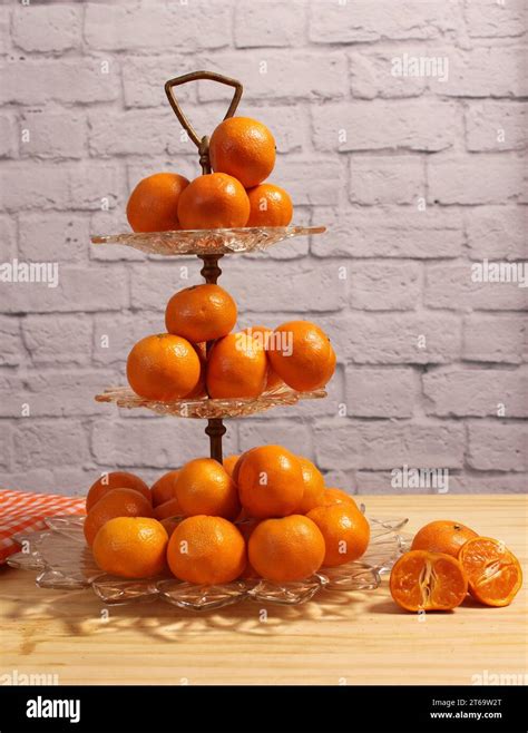Antique Crystal Dish With Small Oranges. Dessert Display With Brick ...