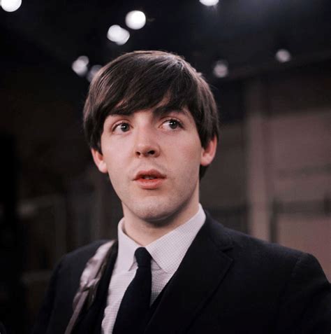 Feb. 1964 file photo, the Beatles' Paul McCartney is shown on the set of the Ed Sullivan Show ...
