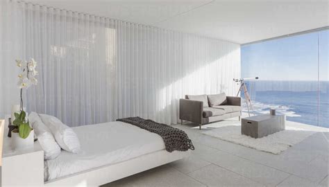 Modern, luxury home showcase bedroom with ocean view stock photo