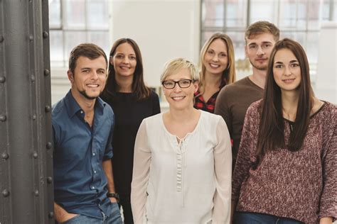 Group portrait of co-workers in office - Mental Health Partners