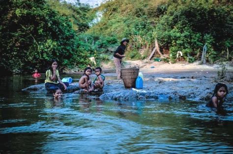 Local people take a bath on the river. - EarthRights International