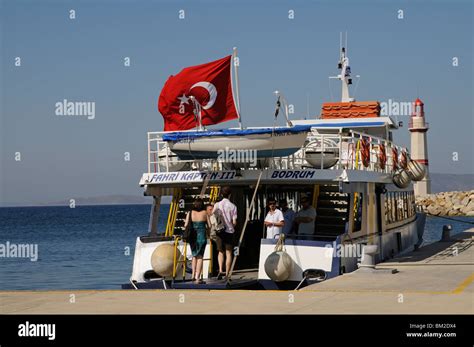 Passengers boarding the Fahri Kaptan III ferry at Turgutreis Marina ...