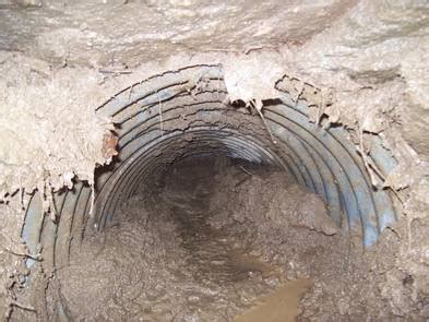 How to unclog a culvert pipe - Country Roads Paving, LLC.