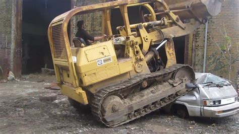 crushing a car with a bulldozer - YouTube