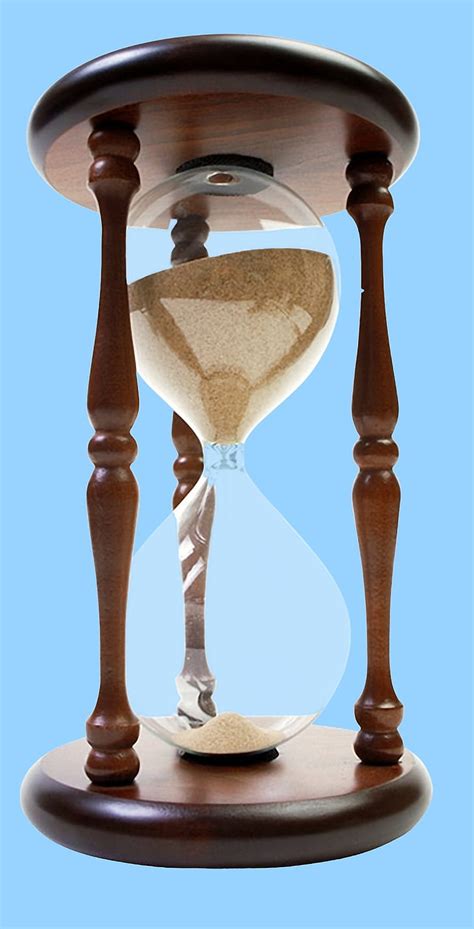 Royalty-Free photo: Brown wooden framed sand hourglass | PickPik