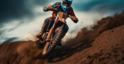 Premium Photo | A woman rider on an orange dirt bike doing stunts