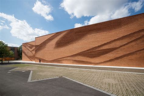 An Undulating Brick Facade Imitates the Free-Flowing Movement of Draped ...