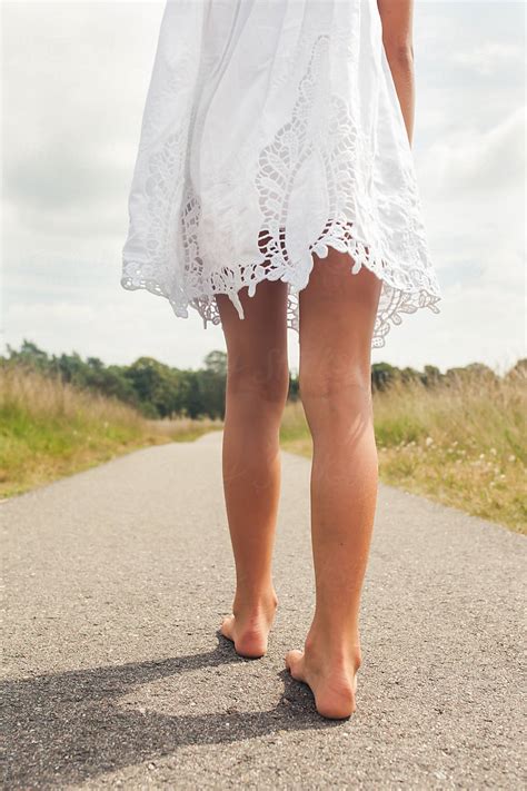 "Bare Feet And Legs Of A Little Girl In A White Dress" by Stocksy ...