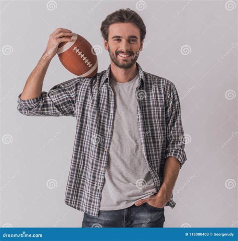 Handsome man with ball stock image. Image of hold, hobby - 118080403