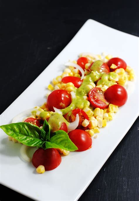 Raw corn salad with basil vinaigrette | white plate blank slate