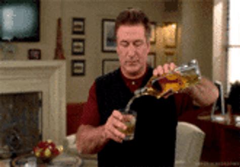 Alec Baldwin Pouring Drink GIF | GIFDB.com