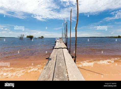 Wooden pier and sand beach on the Amazon River in Manaus, Brazil Stock Photo - Alamy