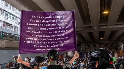 Hong Kong’s New Weapon Against Protesters: A Purple Warning Flag - The New York Times