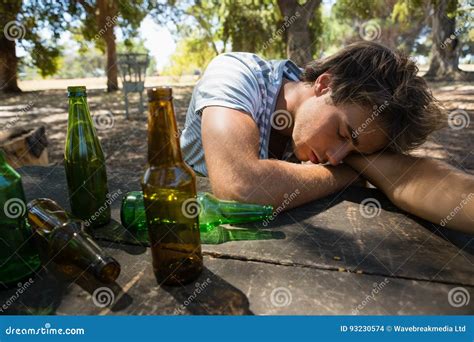 Drunken Man Sleeping on the Table in the Park Stock Photo - Image of ...