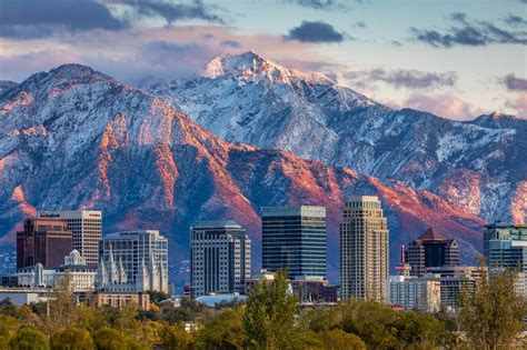 The summits of Utah dramatic Wasatch Mountain Range stand proudly above ...