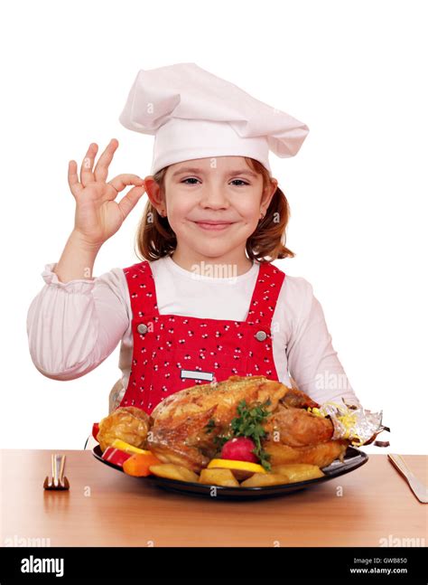 beautiful little girl cook with grilled chicken Stock Photo - Alamy