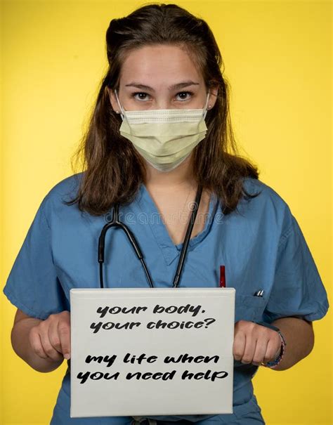 Nurse Holding a Small White Sign in Protest. Stock Photo - Image of confident, indoors: 182353214