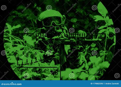 Portrait Of A Commando In The Night Sight Of A Sniper Rifle. The ...