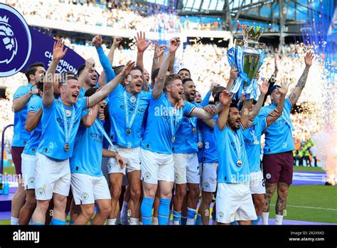 City players lift the Premier League trophy in celebration after the ...