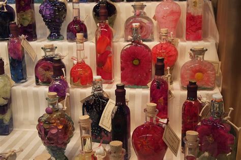 silk flowers inside bottles with oil as oil lamps | Philadel… | Flickr