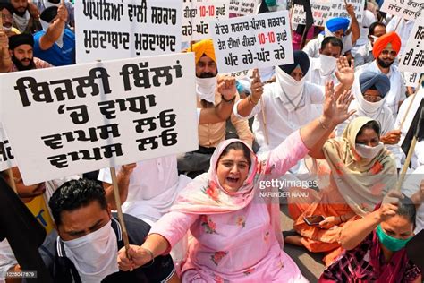 Shiromani Akali Dal party workers hold placards and shout slogans... News Photo - Getty Images