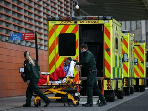 Hospitals are full to capacity and ambulance services are buckling under pressure as UK records ...