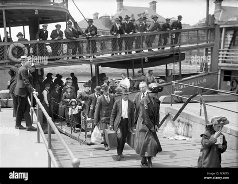 Ellis Island Immigrants. Immigrants disembarking at Ellis Island, New ...