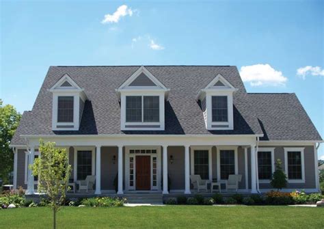 Beautiful Gray Cape Cod Style Home With White Windows Frame And Natural ...