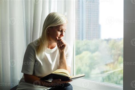 woman praying with bible 17027113 Stock Photo at Vecteezy