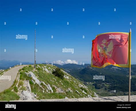 Montenegrin flag waving at the Mausoleum of Petar II Petrovic Njegos Stock Photo - Alamy